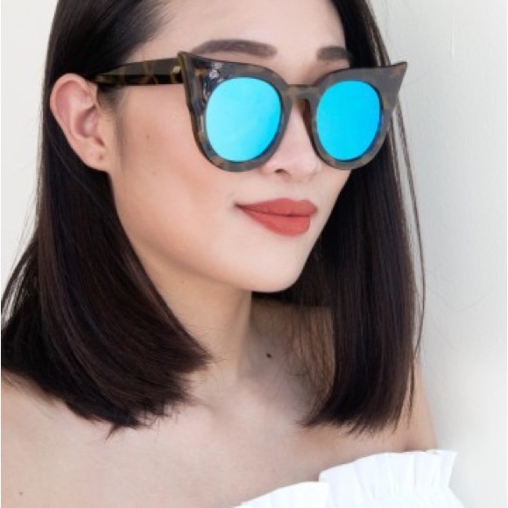 Le Specs Flashy Dramatic Cat Eye Sunglasses in tortoise w/ Blue Lenses